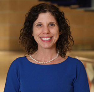headshot of Dr. Kerry Sautner, President and CEO of Eastern State Penitentiary Historic Site. Kerry is wearing a blue dress.