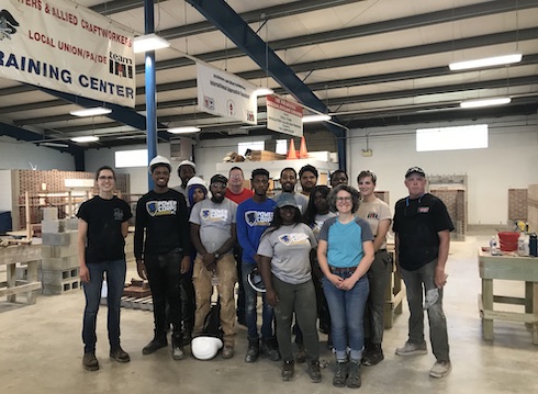 Masonry workshop participants visit the local training center.