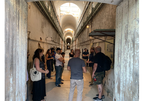 group of people inside a cellblock