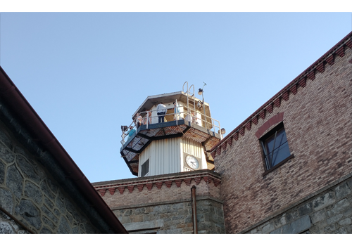 people standing in the central guard tower