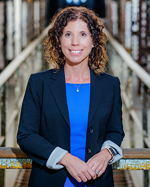 portrait of Kerry Sautner, President and CEO of Eastern State Penitentiary, posing in Cellblock 12